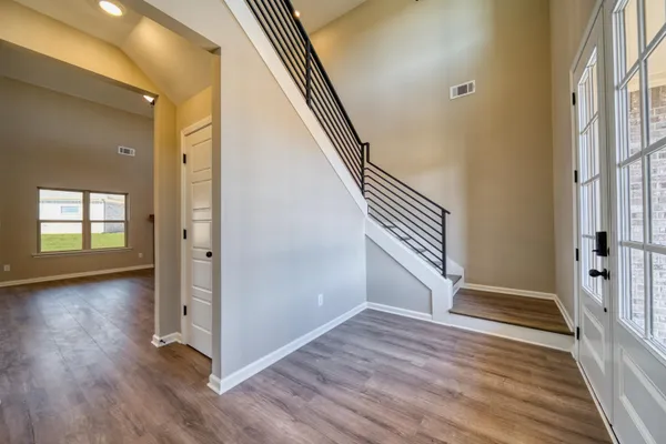 a bathroom with a granite countertop sink toilet tub and shower