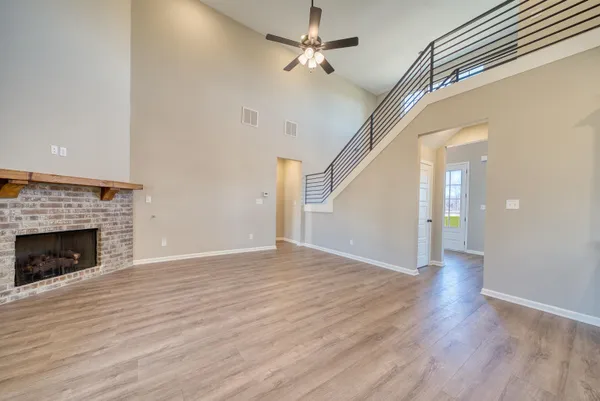 a kitchen with kitchen island granite countertop a sink a center island a counter space and a window