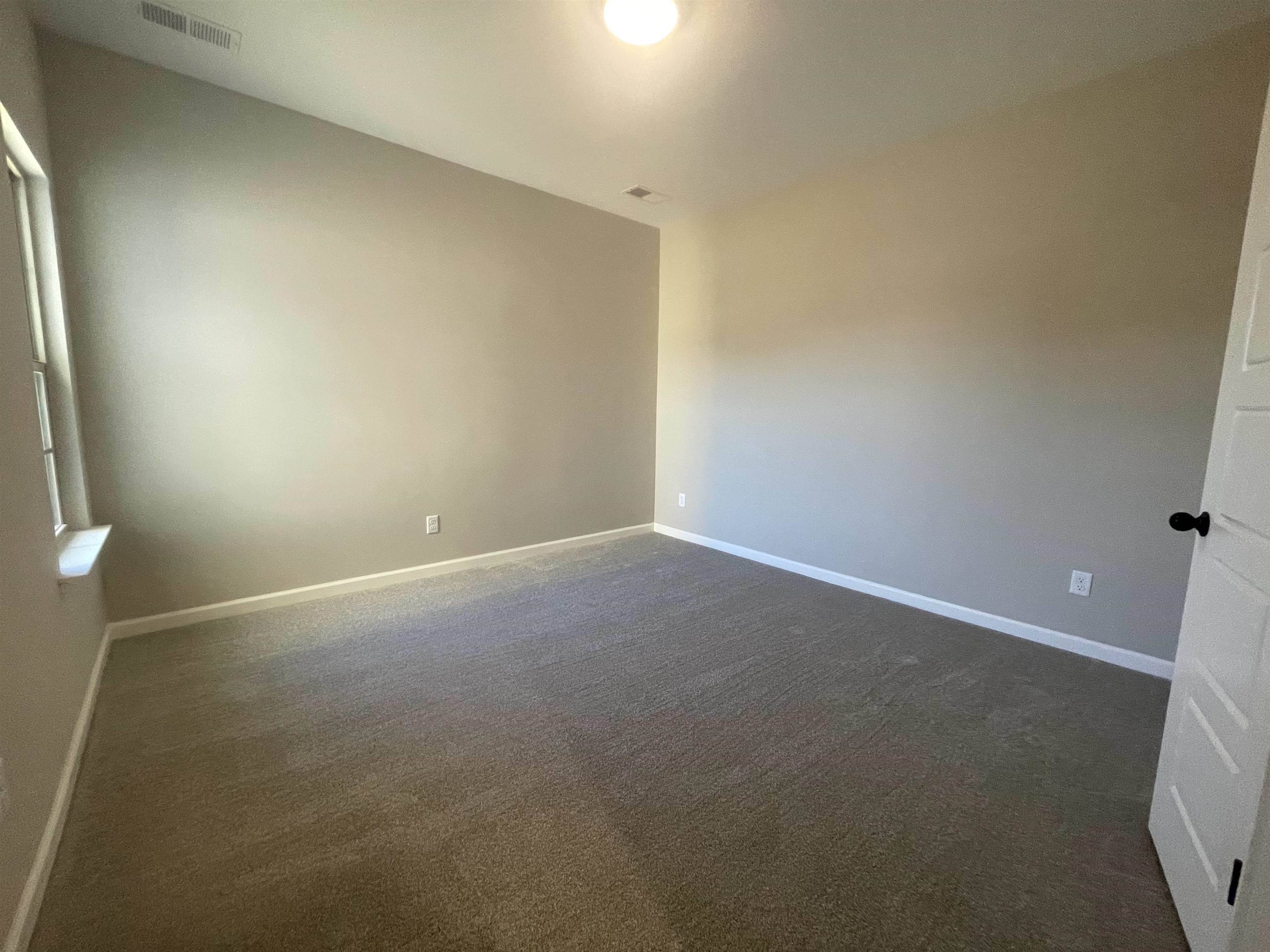 19 Columbia Way Atoka, TN 38004 - Photo 24 of 28 Spare room featuring dark carpet and baseboards