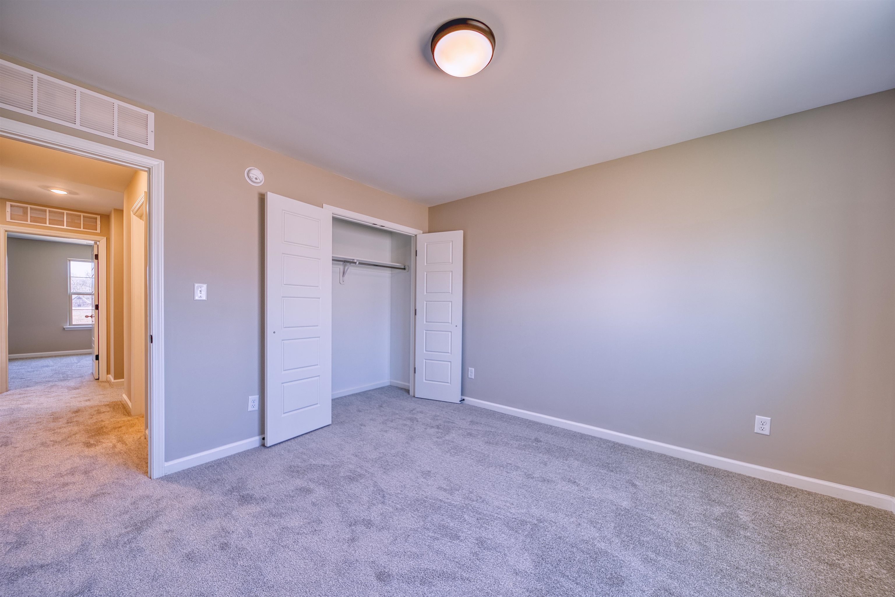 19 Columbia Way Atoka, TN 38004 - Photo 29 of 40 Unfurnished bedroom with carpet floors and a closet