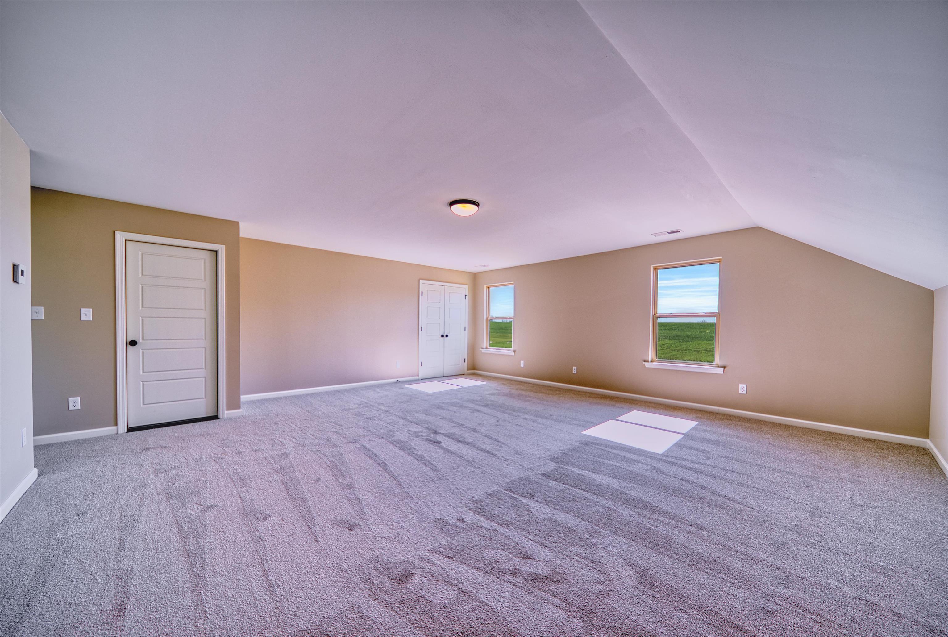 19 Columbia Way Atoka, TN 38004 - Photo 31 of 40 Additional living space with carpet and lofted ceiling