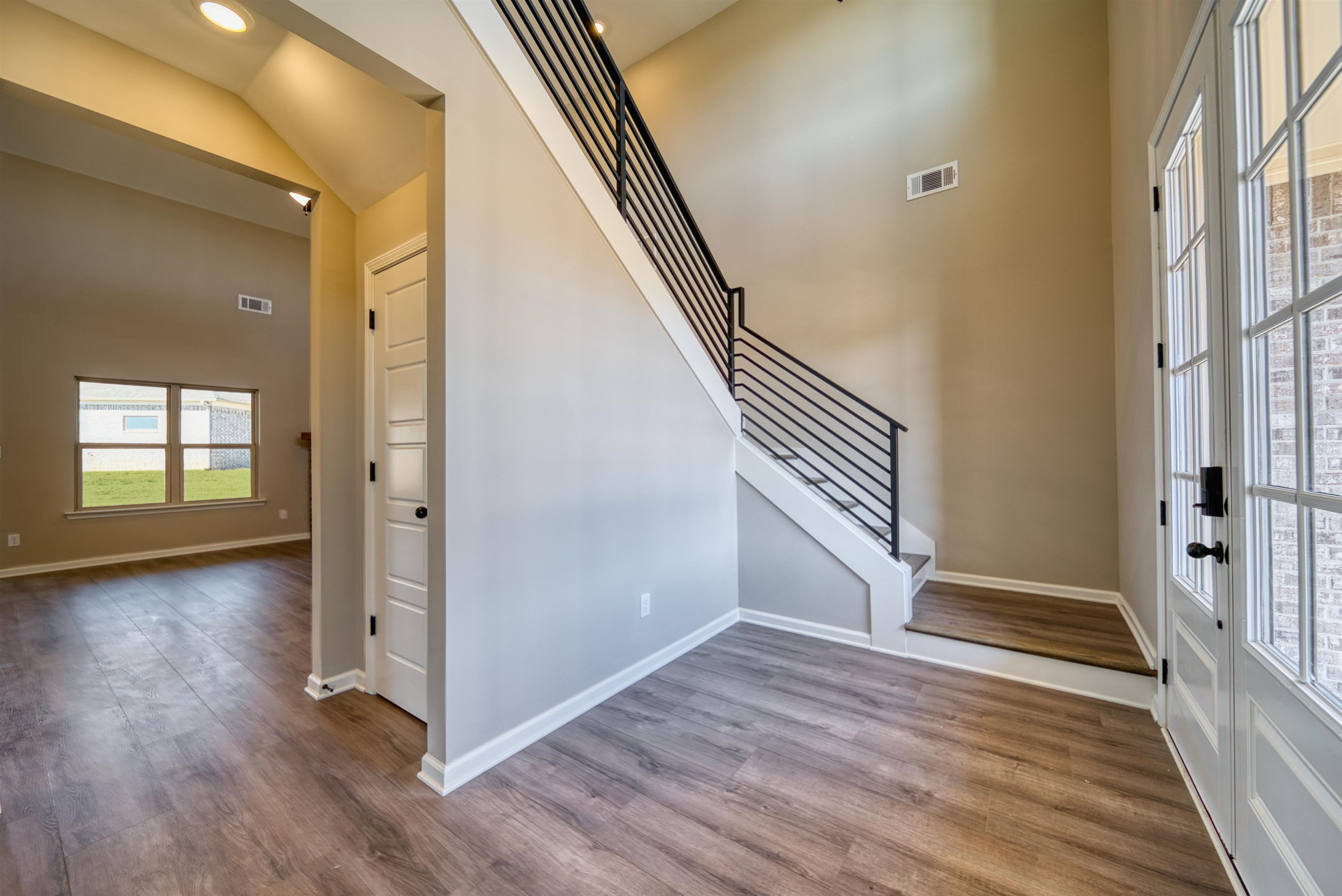 19 Columbia Way Atoka, TN 38004 - Photo 4 of 40 Foyer with wood finished floors and lofted ceiling