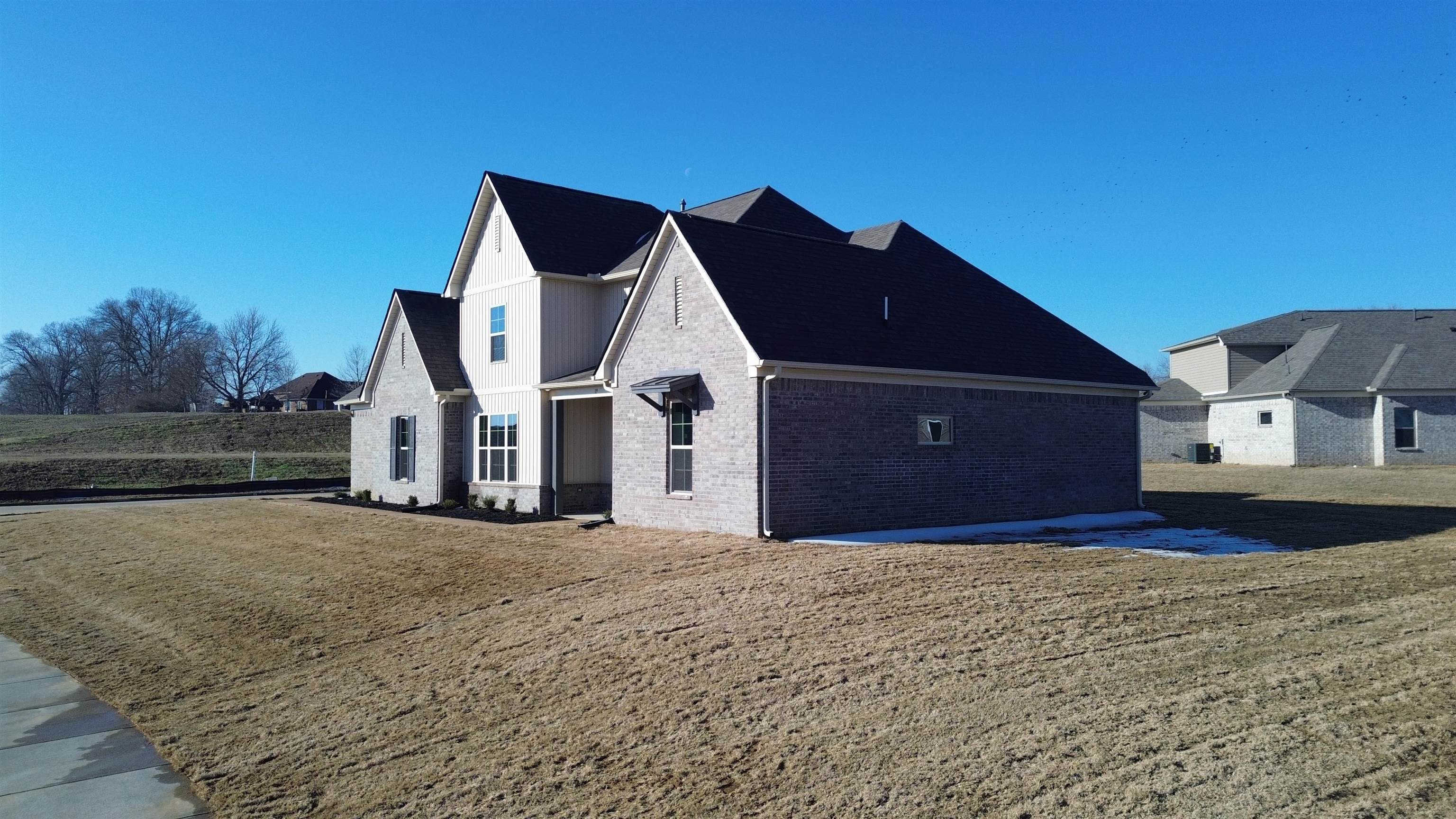 19 Columbia Way Atoka, TN 38004 - Photo 7 of 28 View of front of house featuring a front yard and brick siding