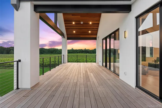 a view of swimming pool with wooden floor and outdoor space