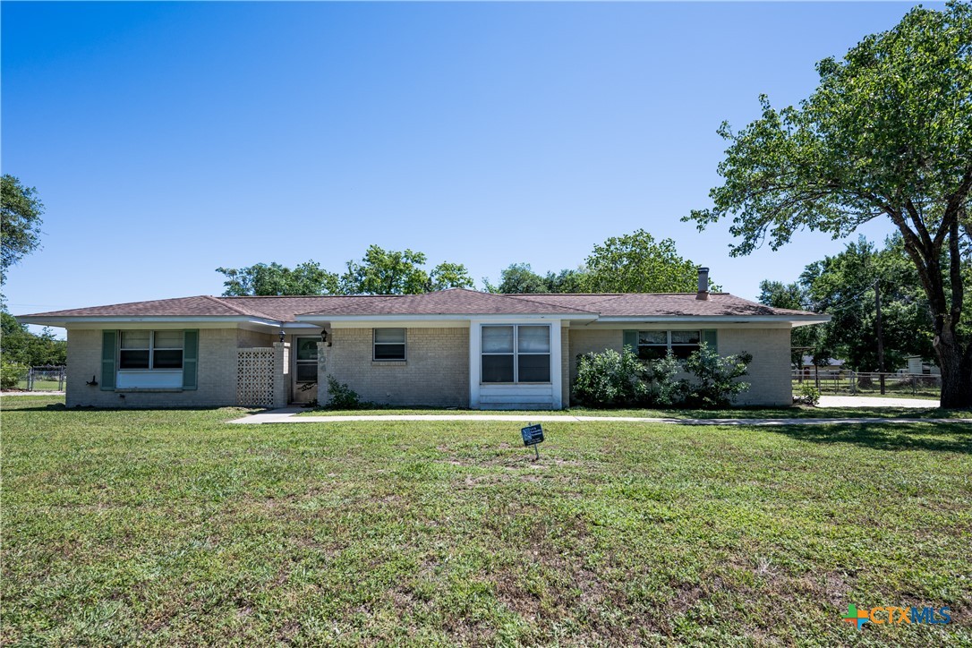 404 Rhodes Road Victoria, TX 77904 - Photo 1 of 36 a front view of house with yard and green space