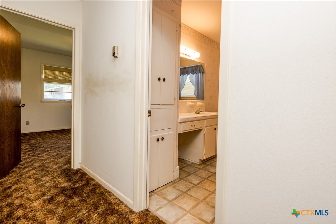 404 Rhodes Road Victoria, TX 77904 - Photo 26 of 36 a view of a bathroom with a sink