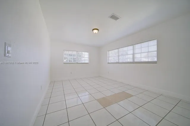 a view of an empty room and window