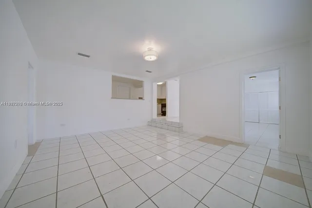 a view of an empty room and window