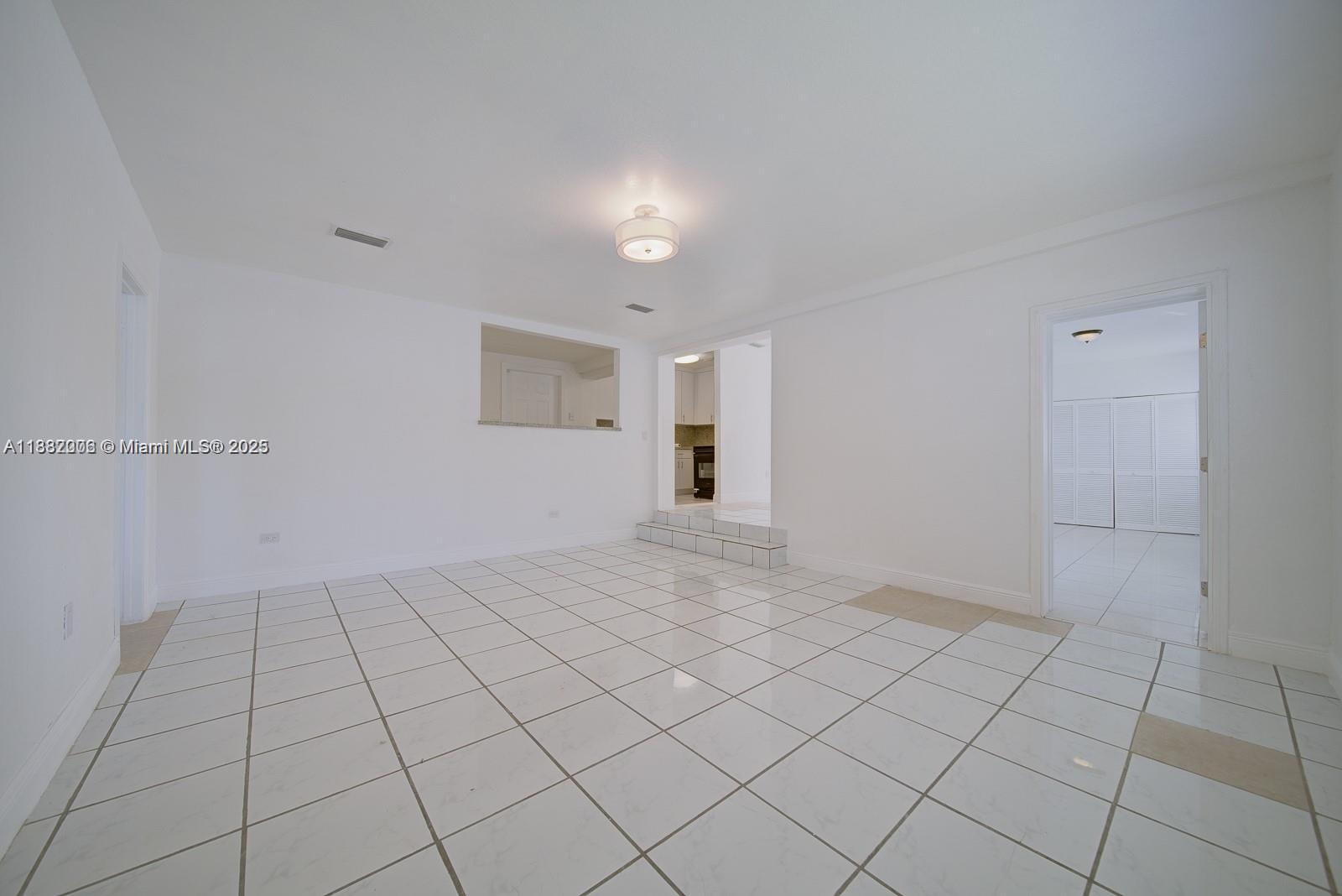 1471 Northwest 93rd Street Miami, FL 33147 - Photo 12 of 26 a view of an empty room and window