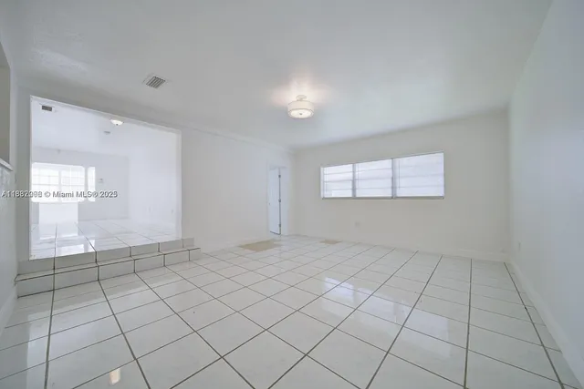 a view of an empty room and window