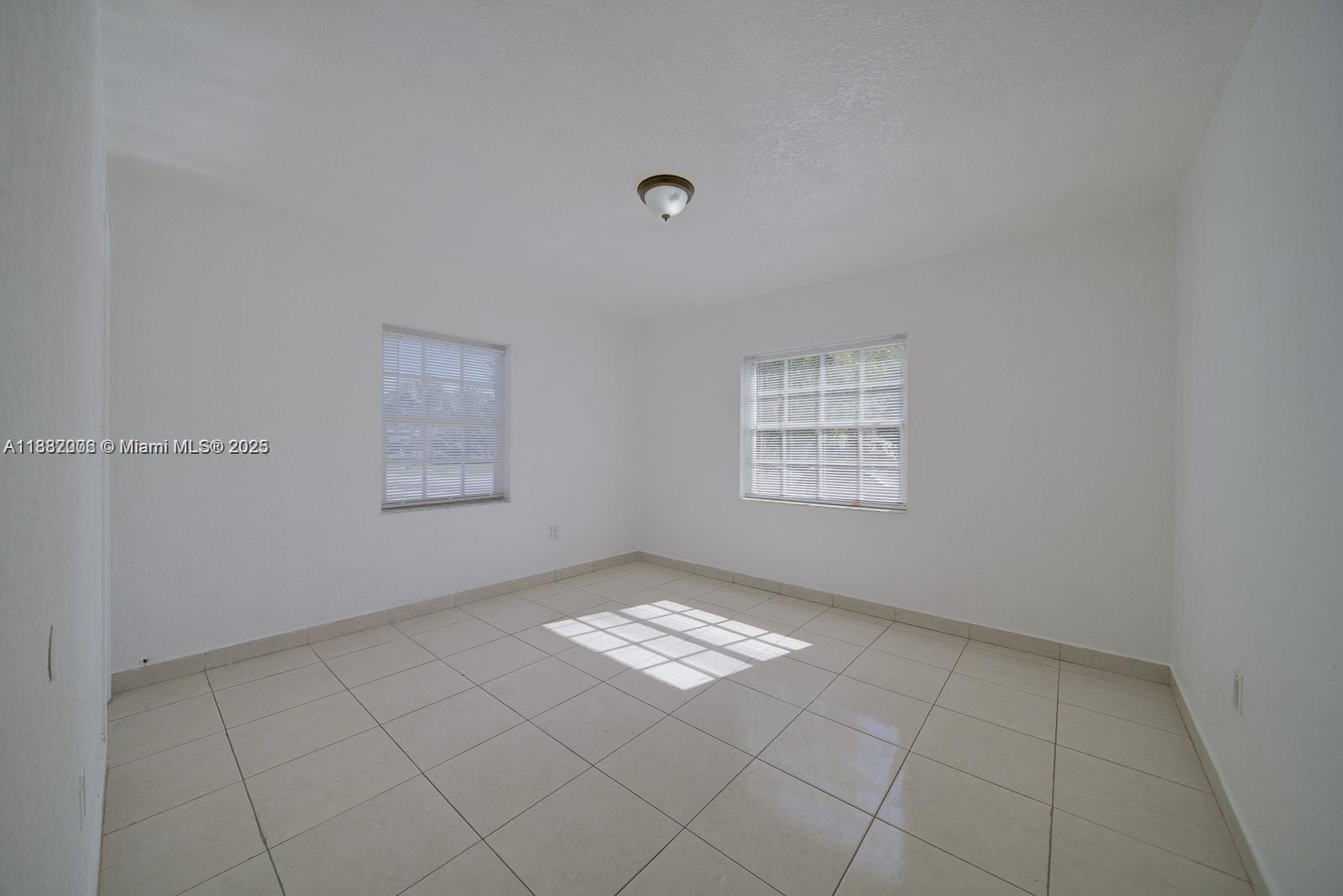 1471 Northwest 93rd Street Miami, FL 33147 - Photo 19 of 26 a view of an empty room and window