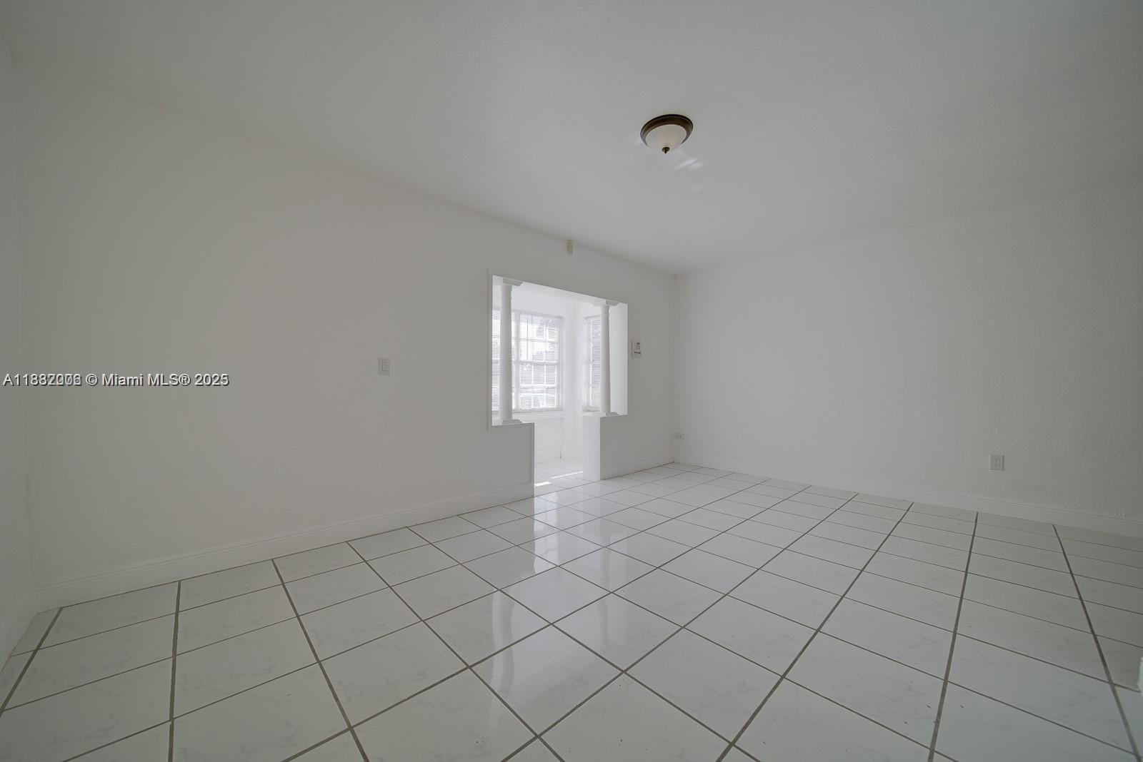 1471 Northwest 93rd Street Miami, FL 33147 - Photo 23 of 26 an empty room with windows