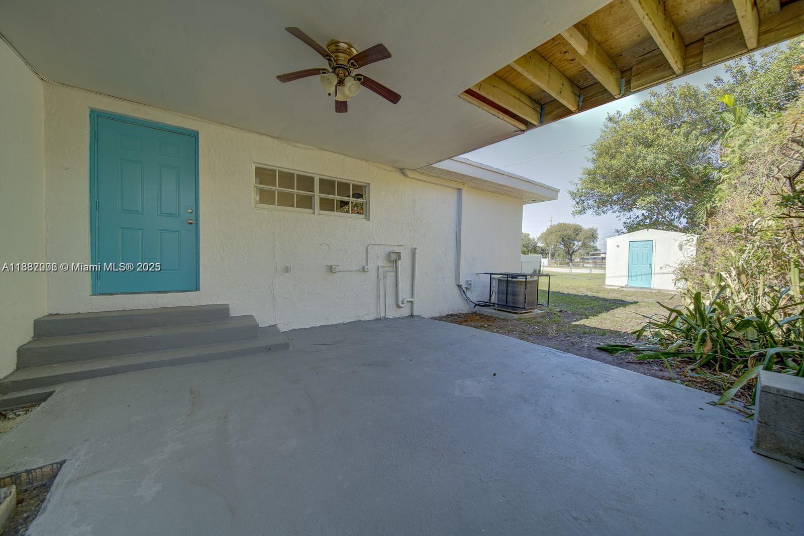 1471 Northwest 93rd Street Miami, FL 33147 - Photo 4 of 26 a view of a house with a patio