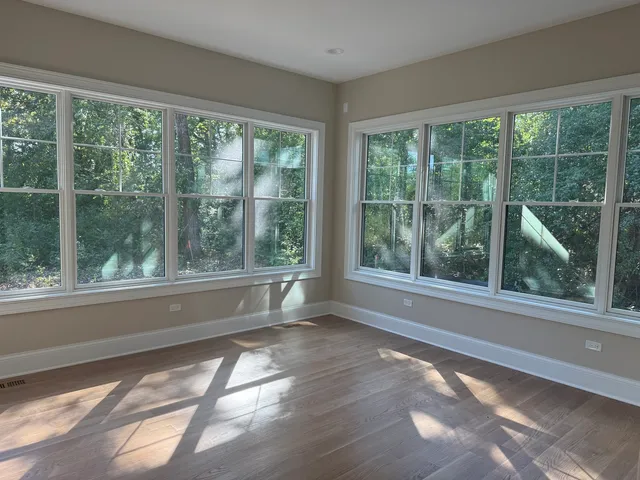 a large kitchen with kitchen island a sink stainless steel appliances and cabinets