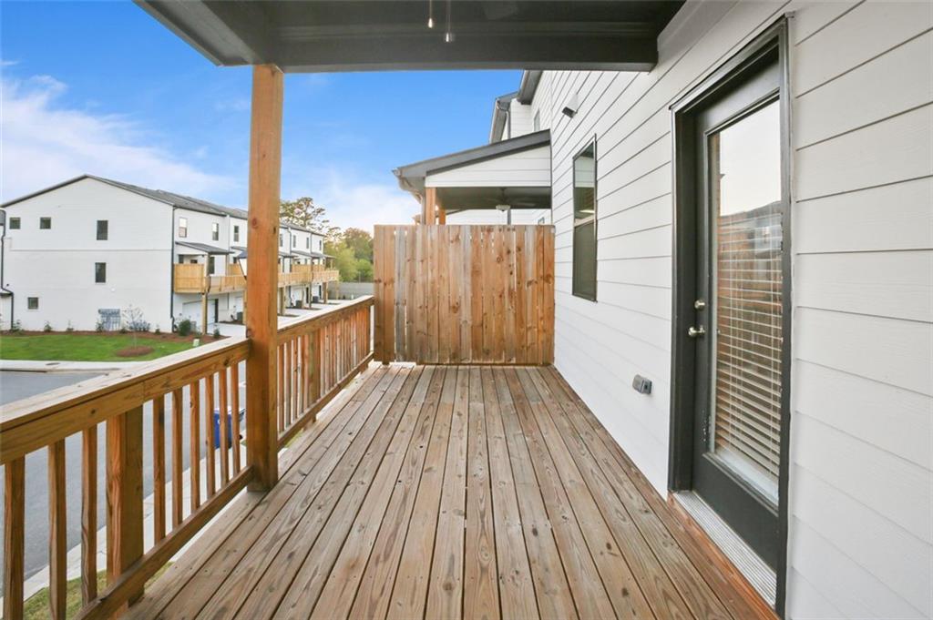 26 Peeples Drive Lawrenceville, GA 30046 - Photo 12 of 24 a view of a balcony with wooden floor