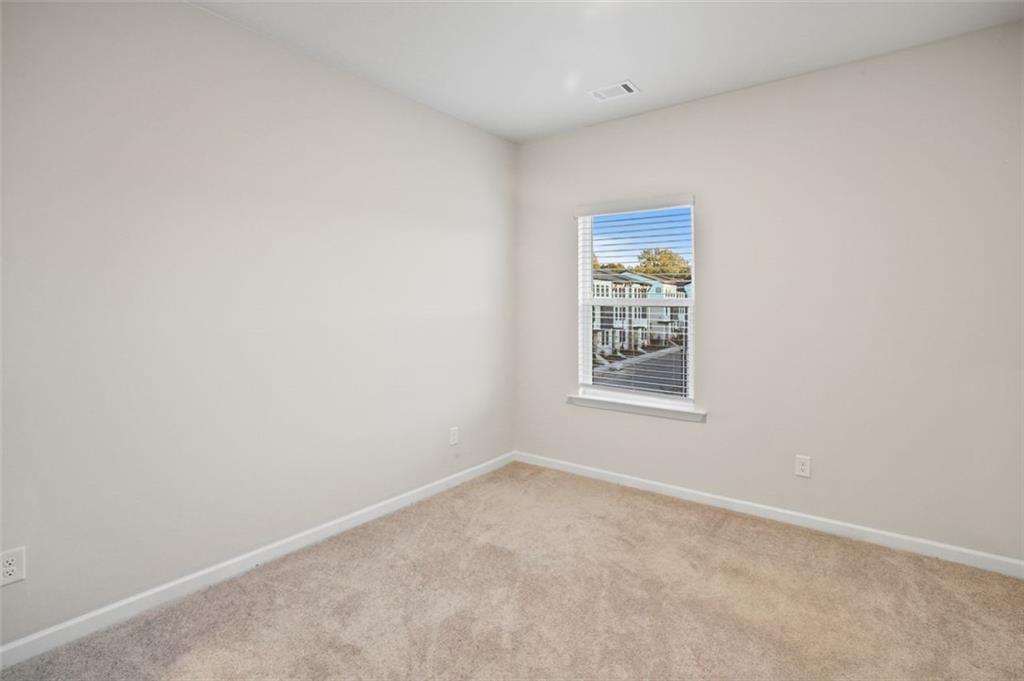 26 Peeples Drive Lawrenceville, GA 30046 - Photo 13 of 24 a view of an empty room with a window