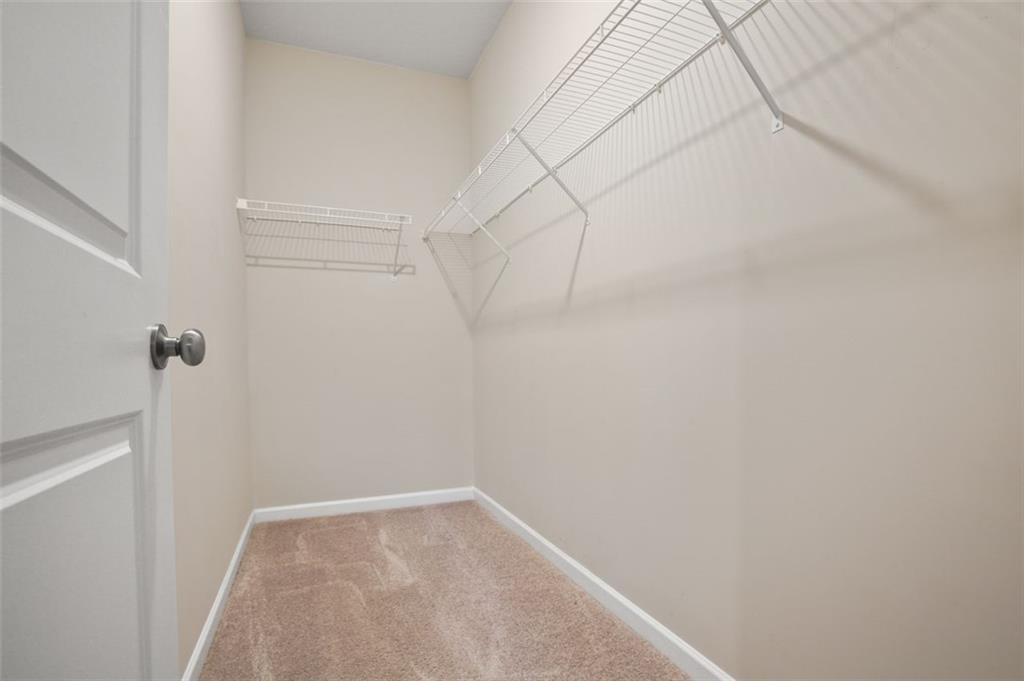 26 Peeples Drive Lawrenceville, GA 30046 - Photo 15 of 24 a view of a room with racks on the wall