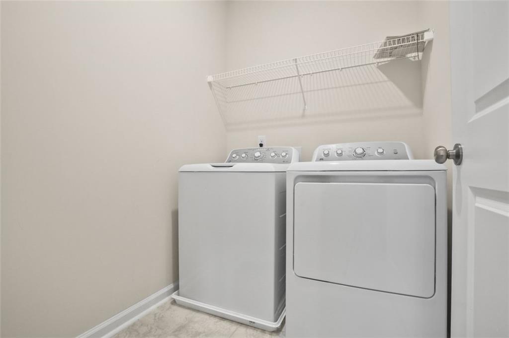 26 Peeples Drive Lawrenceville, GA 30046 - Photo 16 of 24 a utility room with dryer and washer
