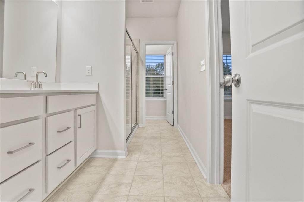 26 Peeples Drive Lawrenceville, GA 30046 - Photo 19 of 24 a bathroom with a sink and a mirror