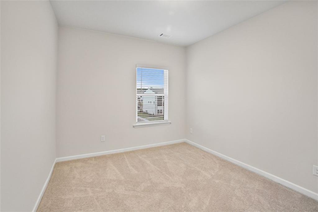 26 Peeples Drive Lawrenceville, GA 30046 - Photo 20 of 24 an empty room with a window