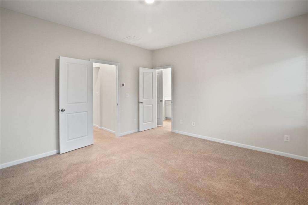 26 Peeples Drive Lawrenceville, GA 30046 - Photo 23 of 24 an empty room with a natural light
