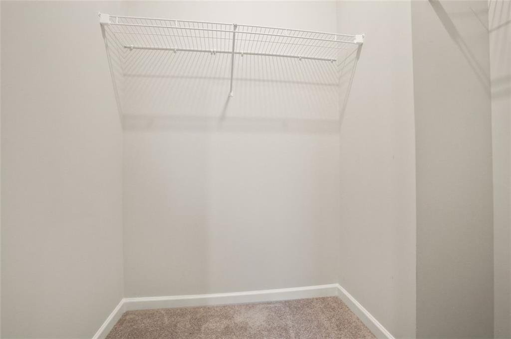 26 Peeples Drive Lawrenceville, GA 30046 - Photo 24 of 24 a view of a room with racks on the wall