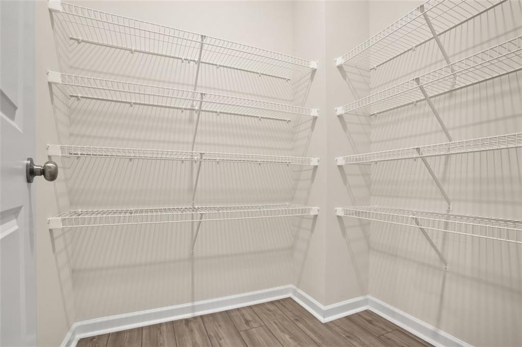 26 Peeples Drive Lawrenceville, GA 30046 - Photo 7 of 24 a view of a room with racks on the wall