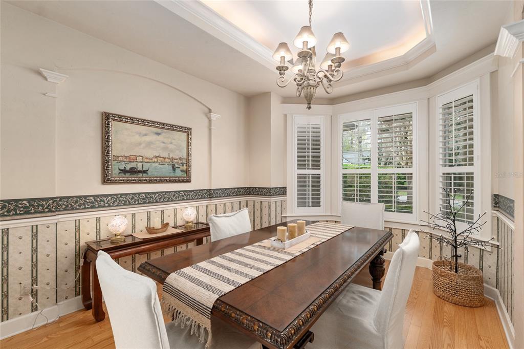 9513 Southwest 33 Lane Gainesville, FL 32608 - Photo 13 of 68 a living room with furniture and a chandelier