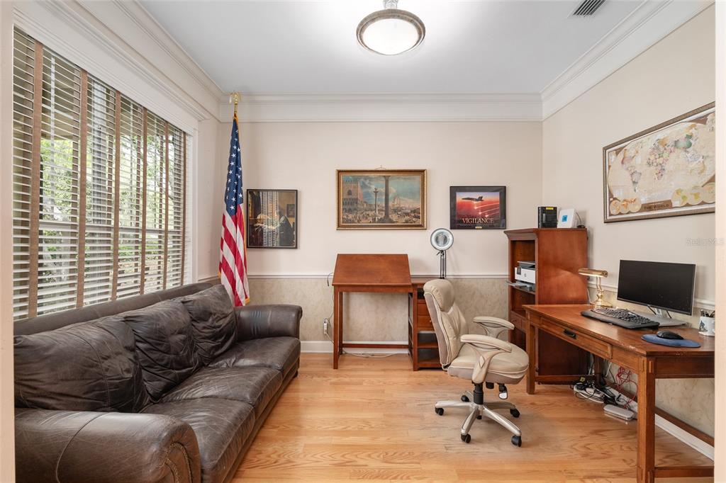9513 Southwest 33 Lane Gainesville, FL 32608 - Photo 15 of 68 a living room with furniture and a flat screen tv