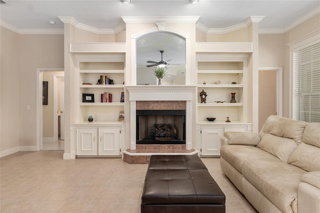 9513 Southwest 33 Lane Gainesville, FL 32608 - Photo 18 of 68 a living room with furniture and a fireplace