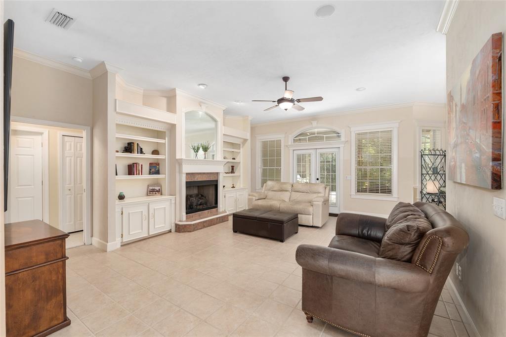 9513 Southwest 33 Lane Gainesville, FL 32608 - Photo 19 of 68 a living room with furniture and a fireplace