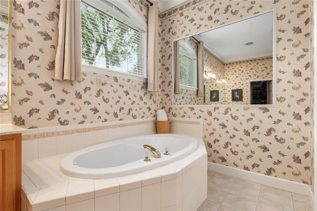 9513 Southwest 33 Lane Gainesville, FL 32608 - Photo 39 of 68 a bathroom with a bathtub and a sink