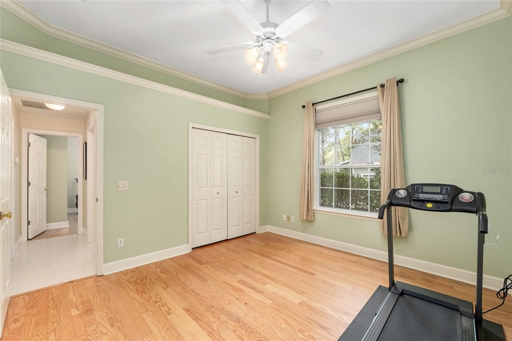 9513 Southwest 33 Lane Gainesville, FL 32608 - Photo 46 of 68 a bedroom with a bed and a window