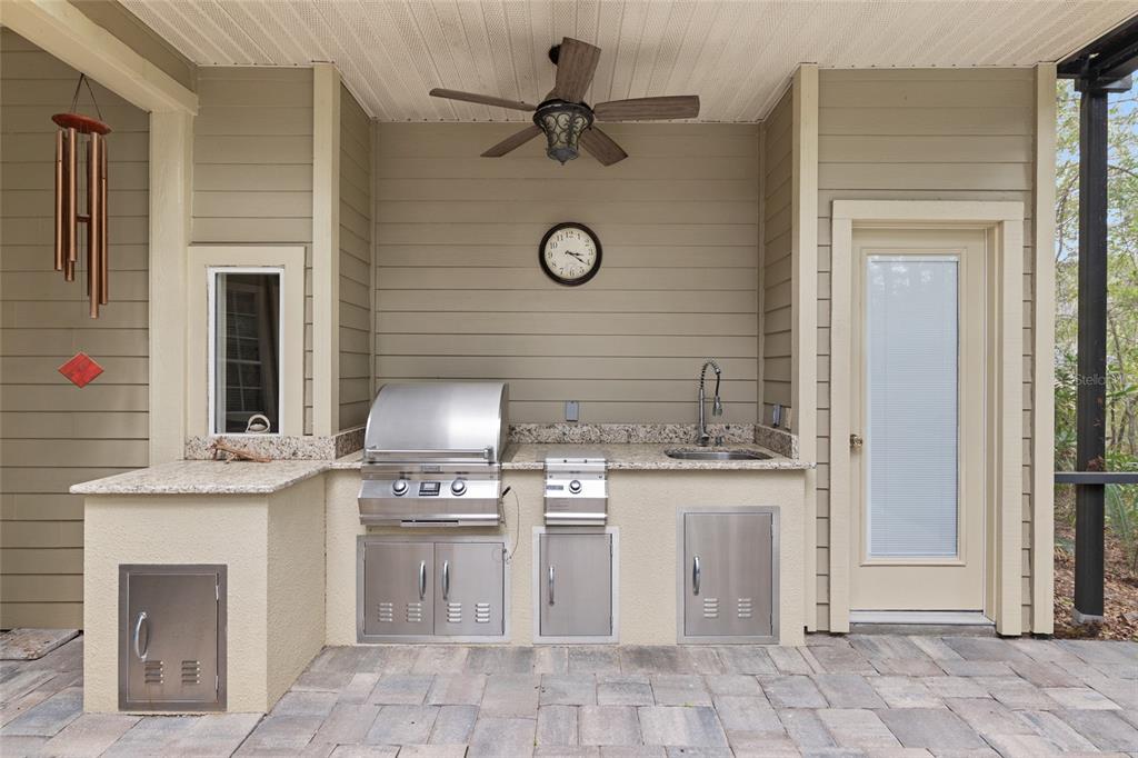 9513 Southwest 33 Lane Gainesville, FL 32608 - Photo 60 of 68 a kitchen with a stove and a fireplace