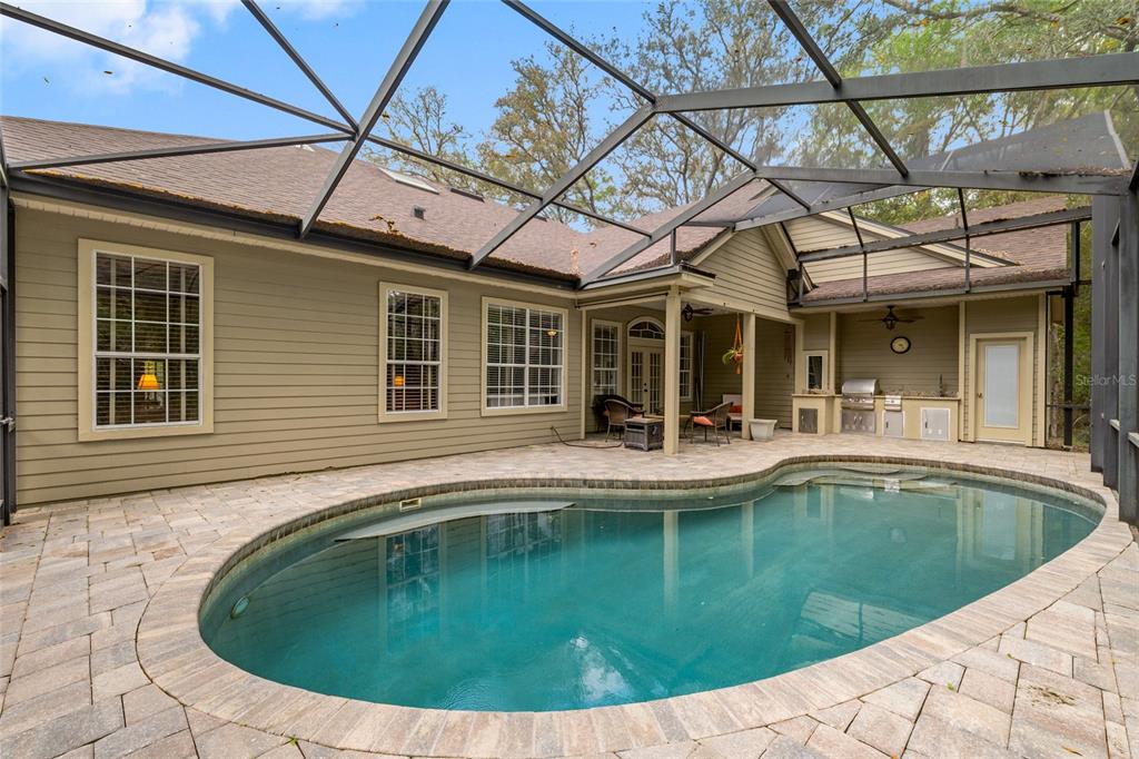 9513 Southwest 33 Lane Gainesville, FL 32608 - Photo 63 of 68 a view of a house with pool