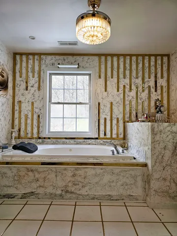 a bathroom with a bathtub and a sink
