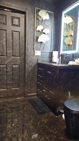 a kitchen with a stove a sink and a refrigerator