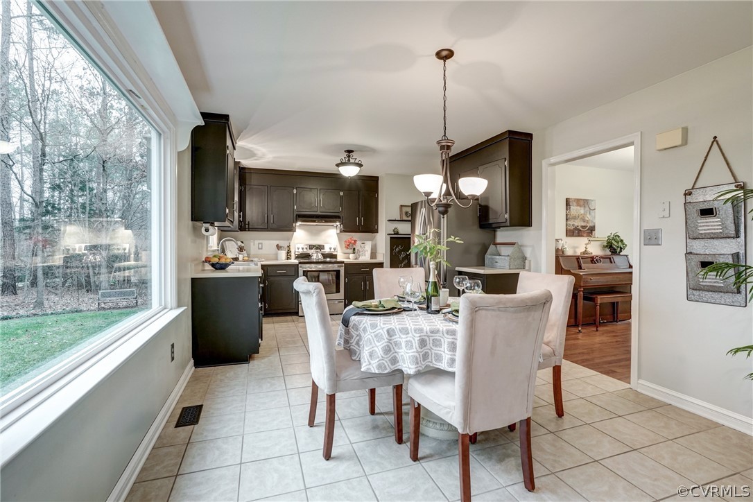 1152 Timber Trace Road Powhatan, VA 23139 - Photo 6 of 38 Eat-in kitchen has a beautiful view of the backyar