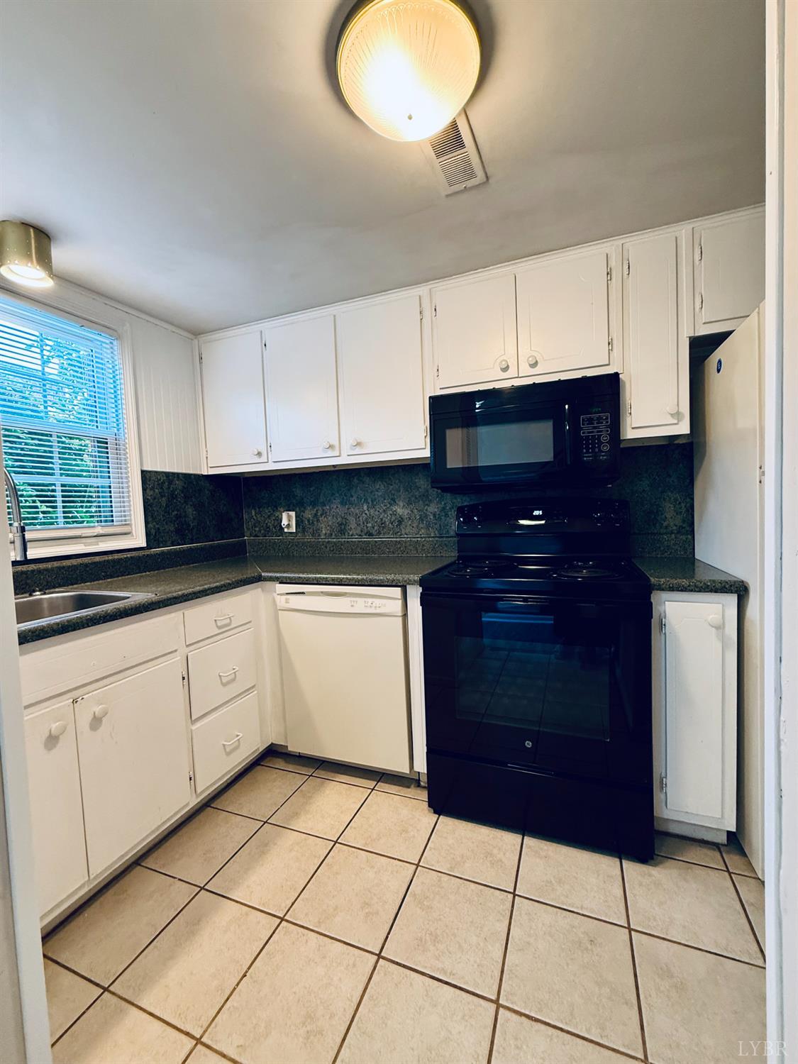 3101 Link Road, Unit 36 Lynchburg, VA 24503 - Photo 14 of 39 a kitchen with a cabinets and a stove top oven