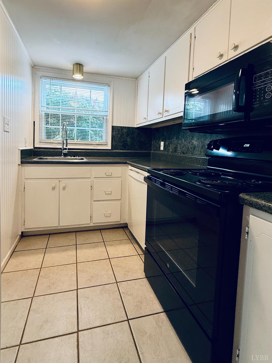 3101 Link Road, Unit 36 Lynchburg, VA 24503 - Photo 16 of 39 a kitchen with stainless steel appliances granite countertop a stove a sink and a microwave