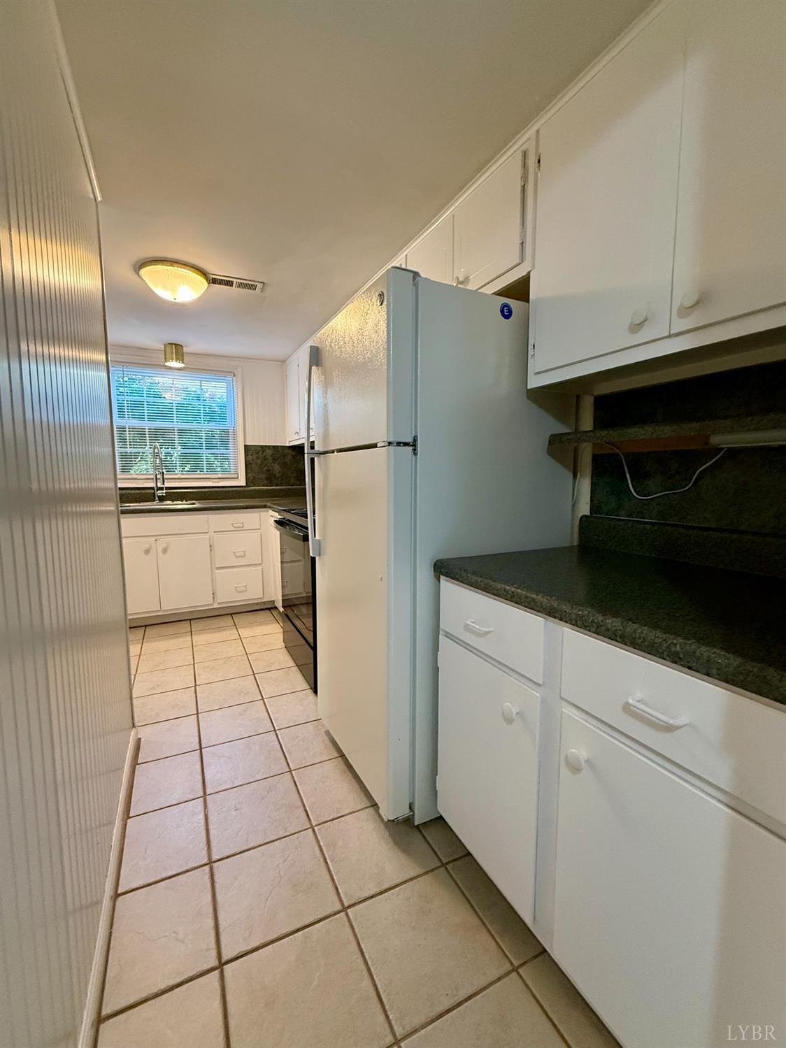 3101 Link Road, Unit 36 Lynchburg, VA 24503 - Photo 18 of 39 a kitchen with stainless steel appliances a refrigerator and cabinets