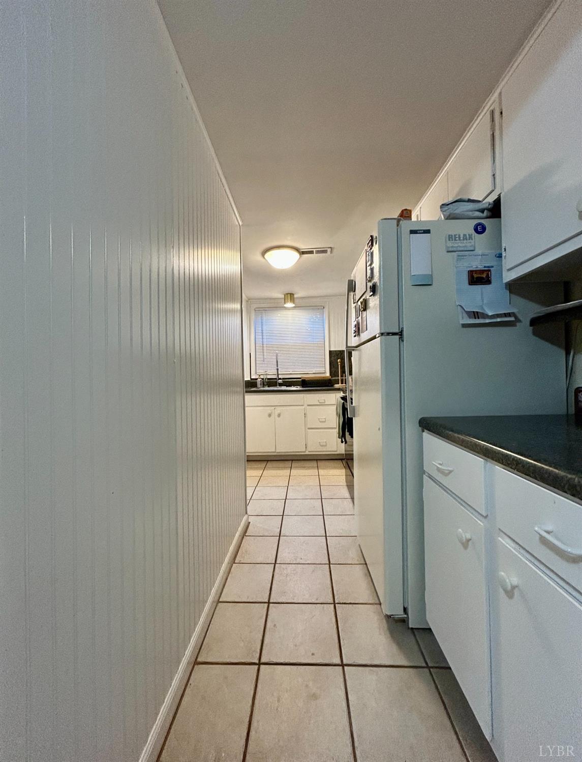 3101 Link Road, Unit 36 Lynchburg, VA 24503 - Photo 19 of 39 a view of a refrigerator in kitchen and an empty room