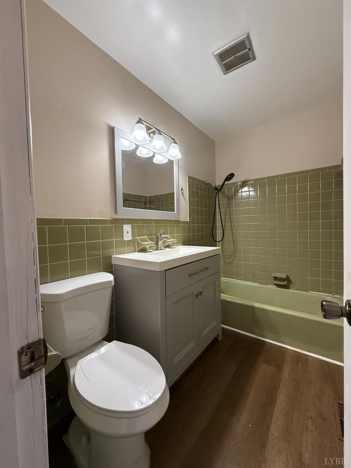 3101 Link Road, Unit 36 Lynchburg, VA 24503 - Photo 30 of 39 a bathroom with a toilet sink and mirror