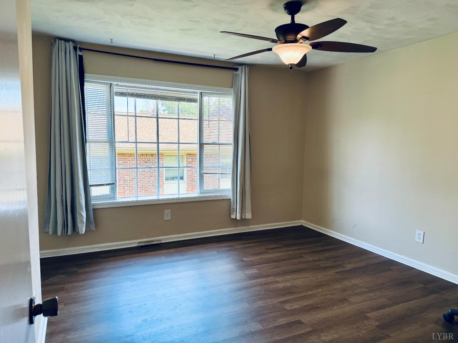 3101 Link Road, Unit 36 Lynchburg, VA 24503 - Photo 31 of 39 an empty room with wooden floor chandelier fan and windows