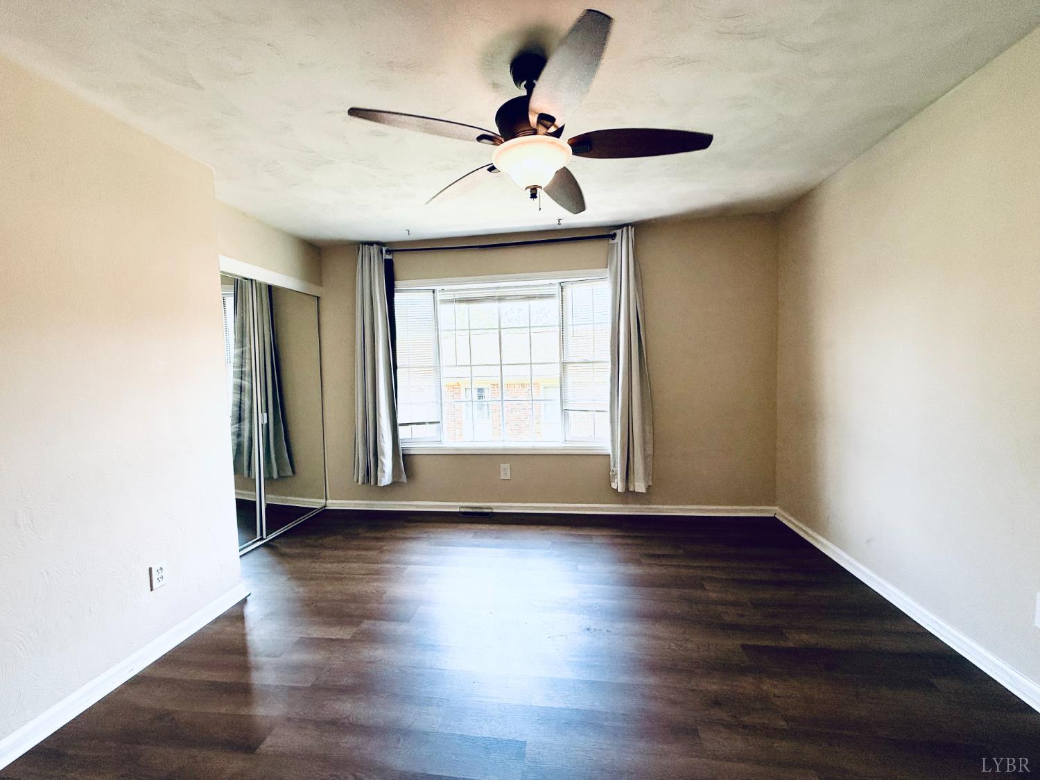 3101 Link Road, Unit 36 Lynchburg, VA 24503 - Photo 32 of 39 a view of empty room with wooden floor and fan