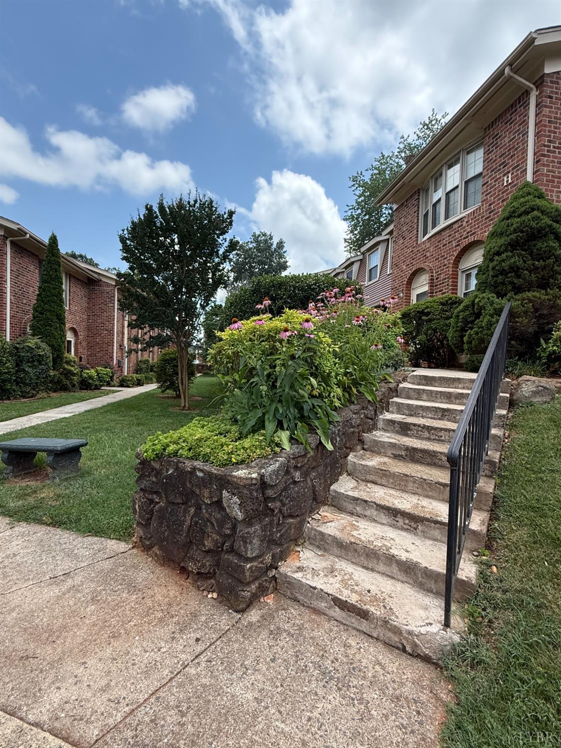 3101 Link Road, Unit 36 Lynchburg, VA 24503 - Photo 35 of 39 a view of a house with a yard and a garden