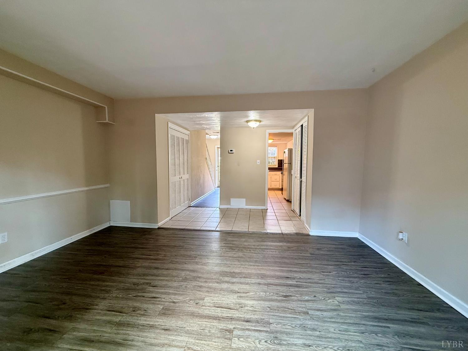 3101 Link Road, Unit 36 Lynchburg, VA 24503 - Photo 8 of 39 a view of an empty room with wooden floor and a window