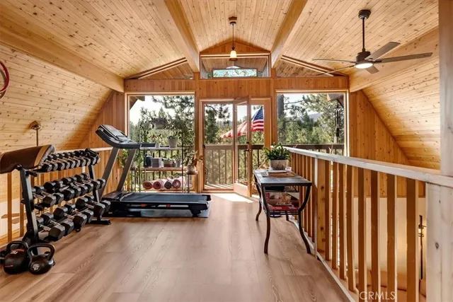 a view of a balcony with couch and wooden floor