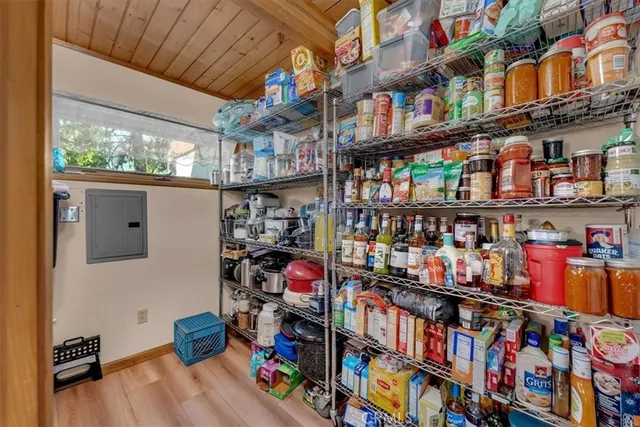 a store room with lots of books and a large window