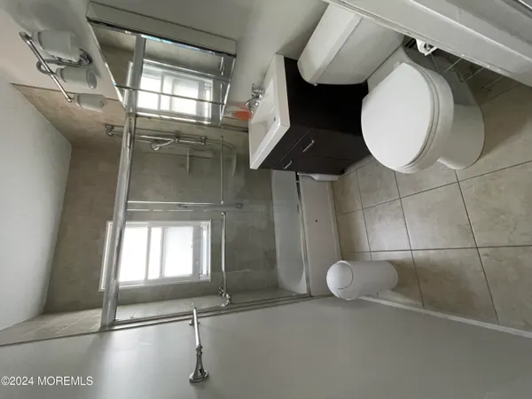 a bathroom with a toilet and a sink